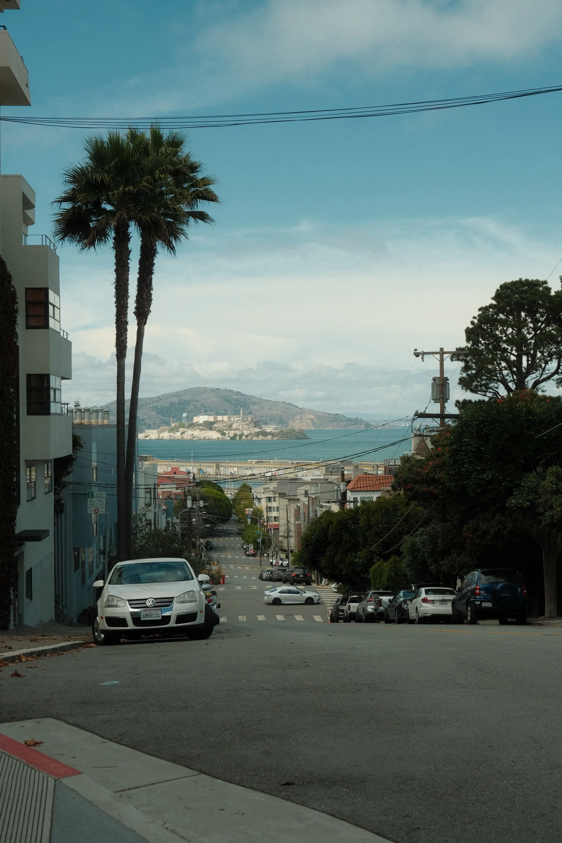 A steep San Francisco street descending toward the bay