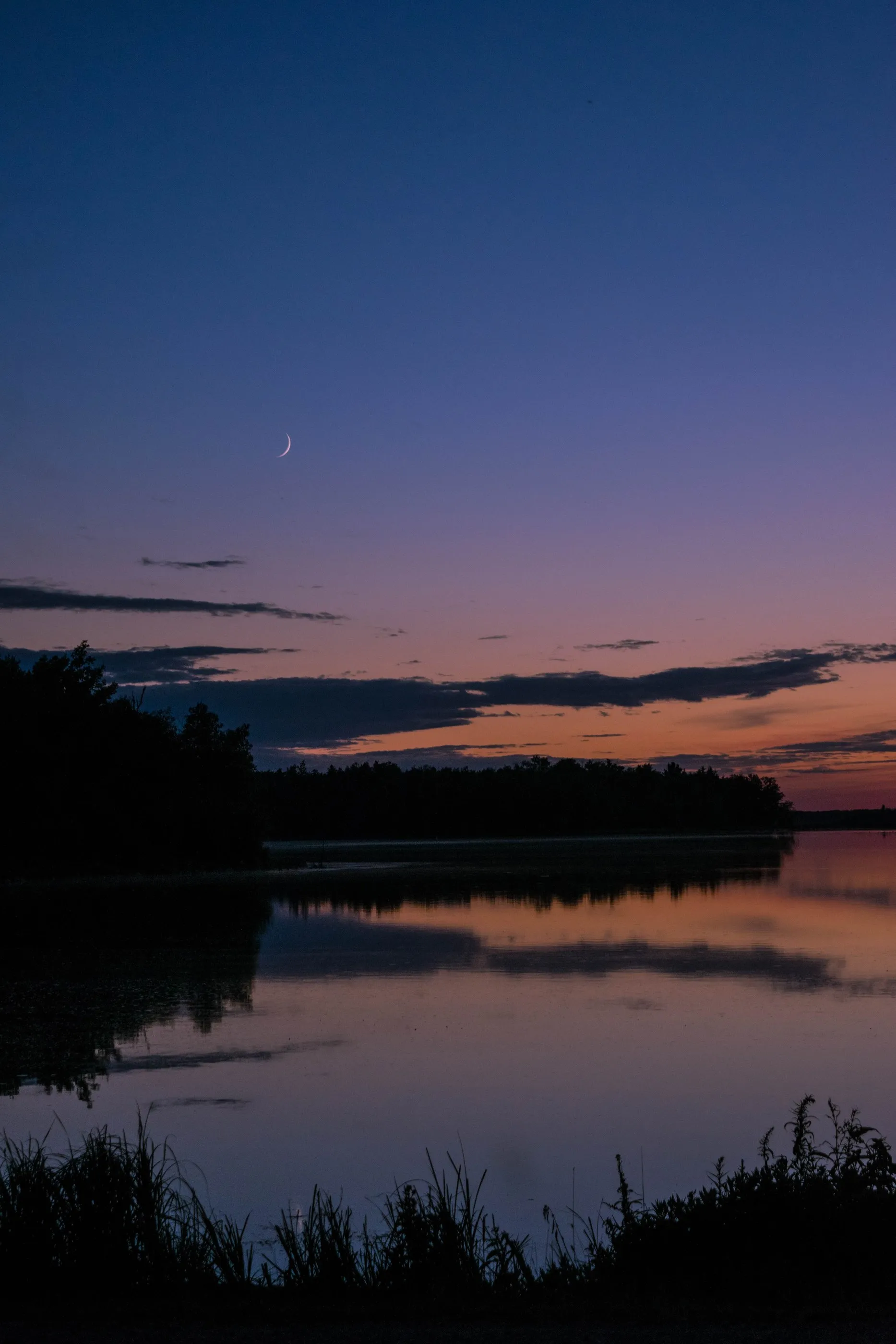 Sunset with a crescent moon
